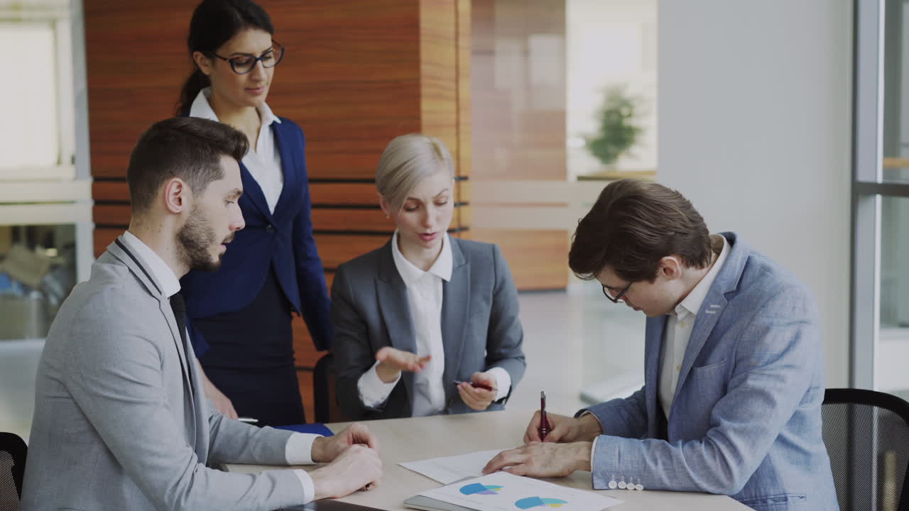 Business Team Meeting and Agreement Signing