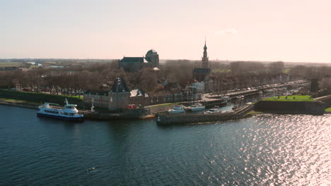 Aerial:-The-historical-town-of-Veere-with-an-old-harbour-and-churches,-on-a-spring-day