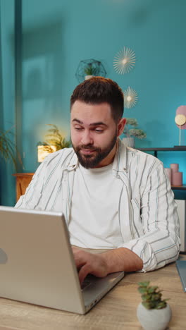 bored sleepy businessman worker working on laptop rubbing eye pinch nose pain headache at office