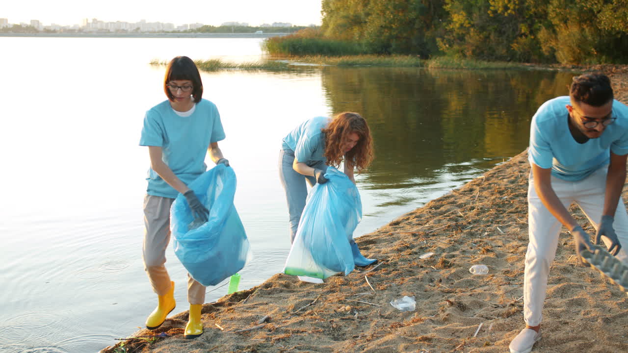 Community Volunteers Cleaning Up a Riverbank