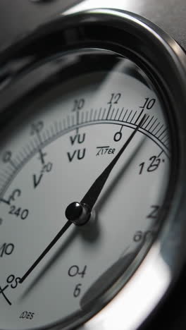 close-up of an analog voltage gauge