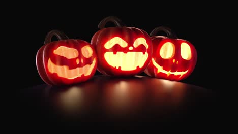 halloween pumpkins are burning, glowing on a dark black background