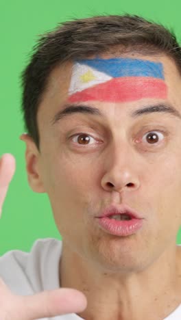 close up of a man supporting philippine team