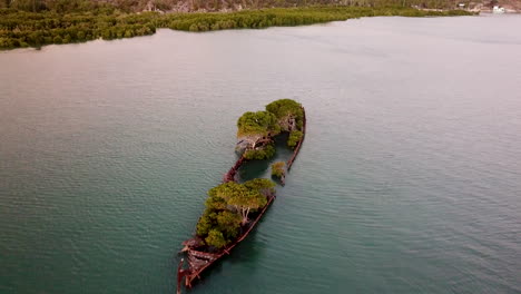 Aerial-footage-flying-over-SS-Adelaide-shipwreck-in-Cockle-Bay-at-sunset-on-Magnetic-Island-in-Queensland-Australia