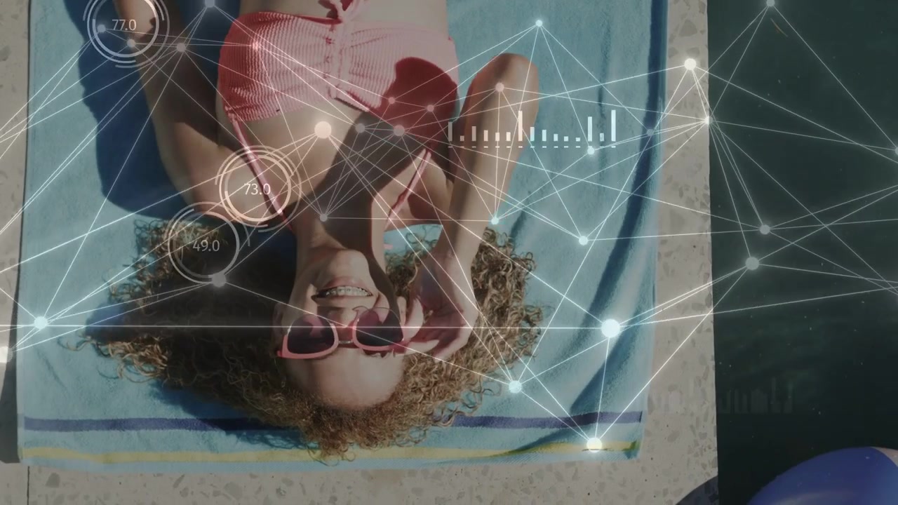 Woman on towel lifting smartphone, tapping and checking chat, starting tech HUD overlaying poolside