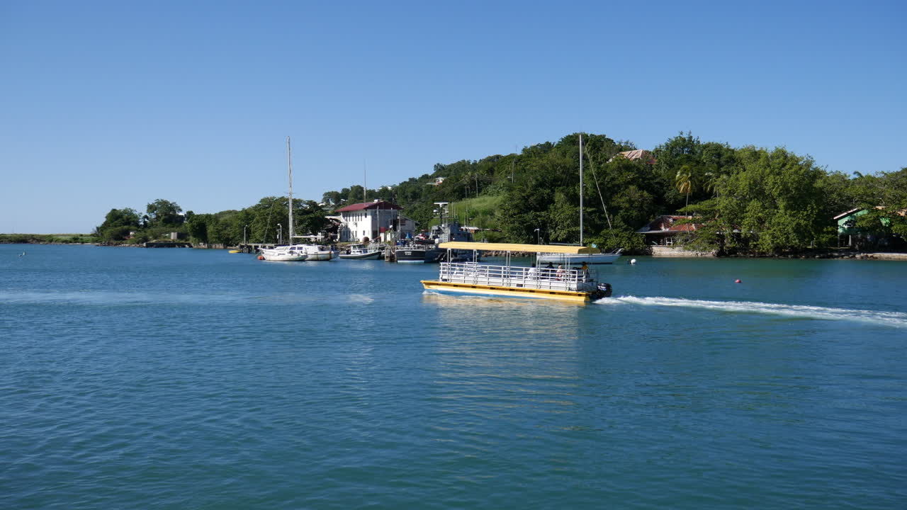 Water taxi leaving harbor in Castries, St. Lucia.