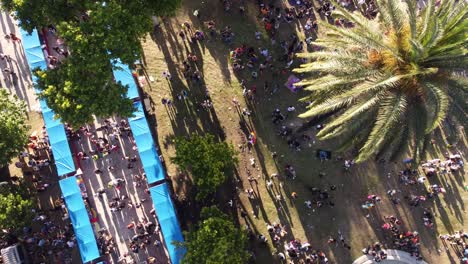 Overhead-Shot-Of-LGBT-Pride-Parade,-Person-Waving-Flag,-Plaza-De-Mayo,-Buenos-Aires