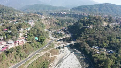 drone aerial view of a bridge and river in himalayas