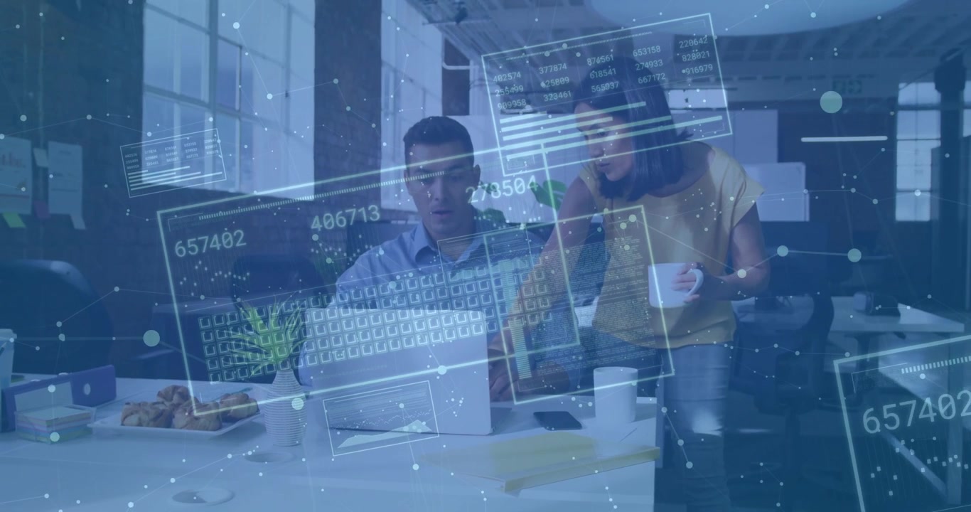 Co-workers collaborating typing in office, tech holographic panels updating data feed around laptop