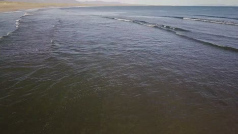 Low-Flight-Over-the-Beach-and-the-Ocean-in-Sunshine-During-Sunny-Summer-In-Snaefellsness-Peninsula,-Iceland