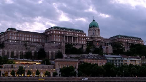 buda castle historical landmark viewed at golden hour twilight from the danube river in budapest hungary