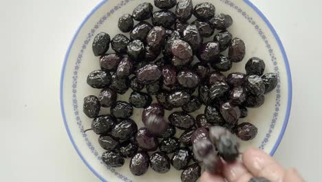 close-up of black olives on a plate