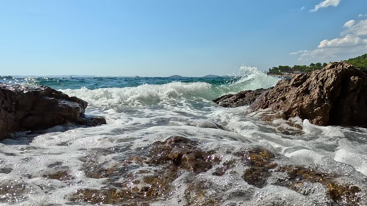Waves Crashing on Rocks at the Beach