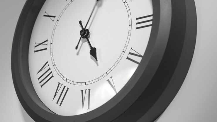 Latin Clock Face in Time Lapse on White Wall