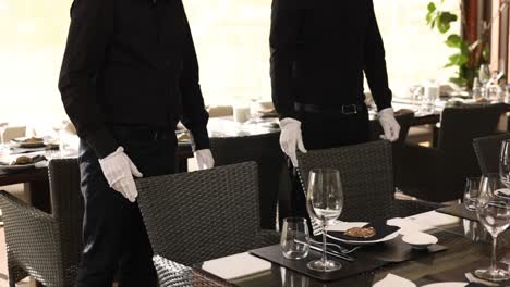 restaurant staff setting a table