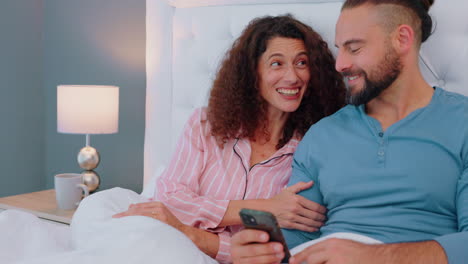 Marriage,-bedroom-and-couple-relax-with-phone