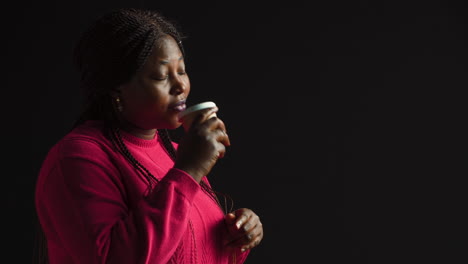 Woman-Sipping-Cup-Of-Coffee