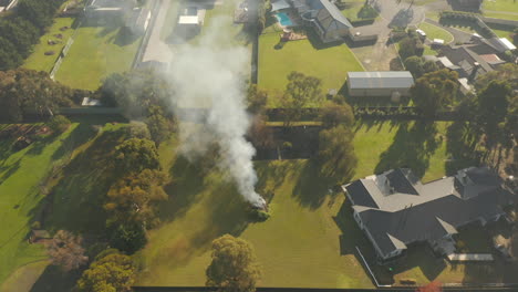 Hyperlapse-of-controlled-burning-taking-place-in-open-backyard-space