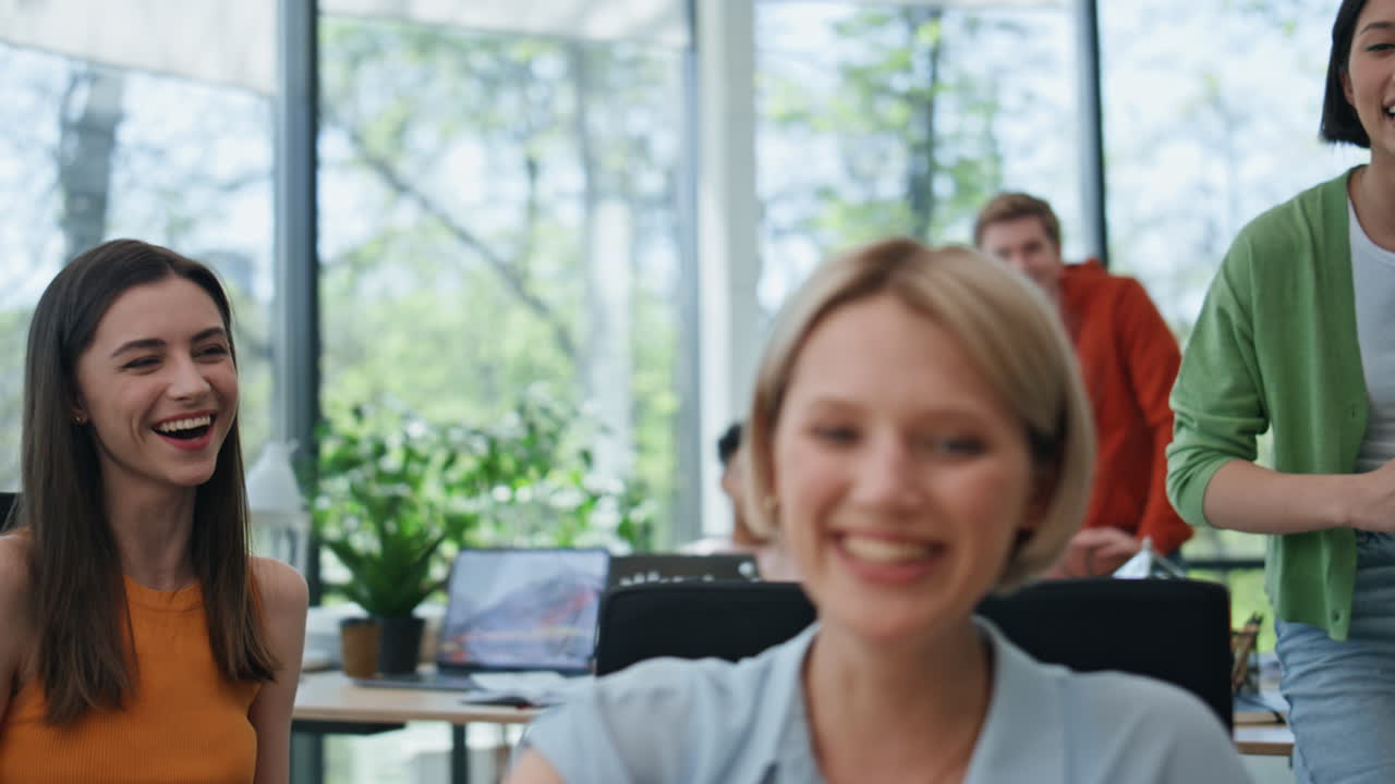 Laughing women colleagues talking corporate boardroom closeup. Group rejoicing
