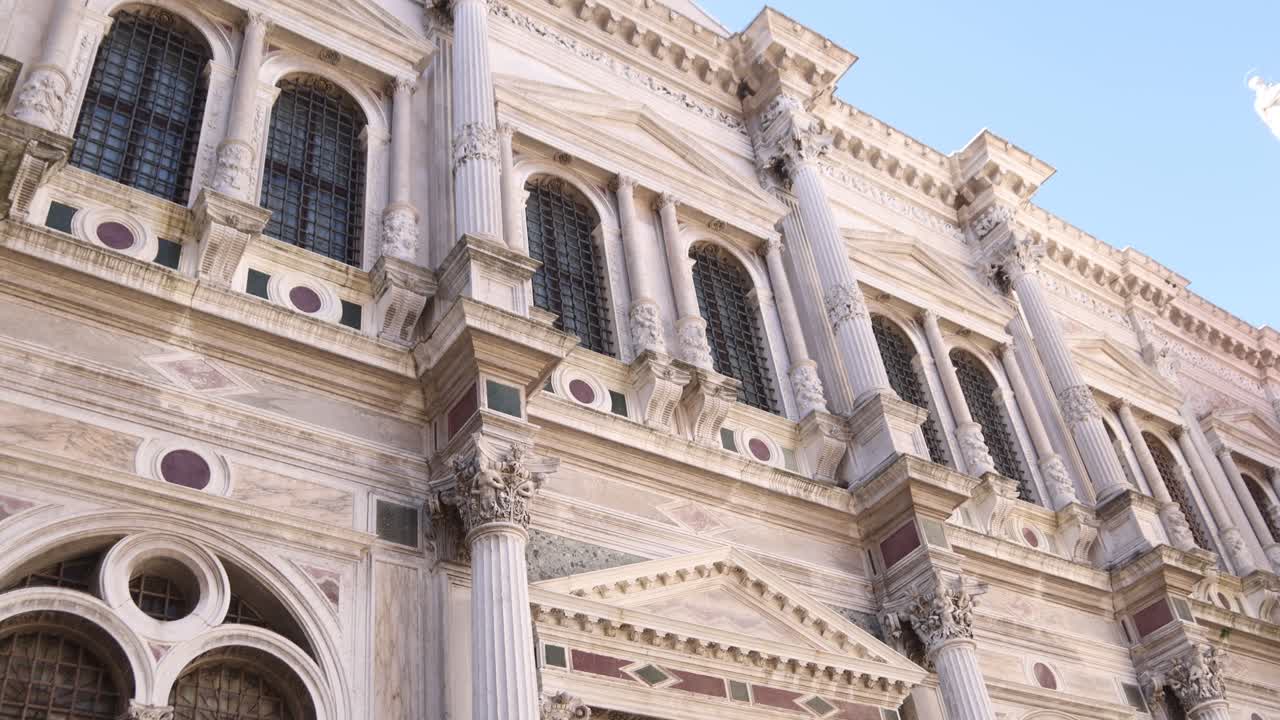 Close-up of intricate Venetian architecture with Corinthian columns and detailed facade.