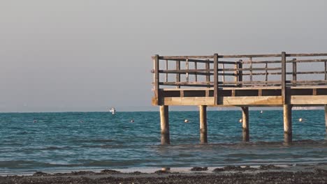 still shot of a pier, bright, serene day