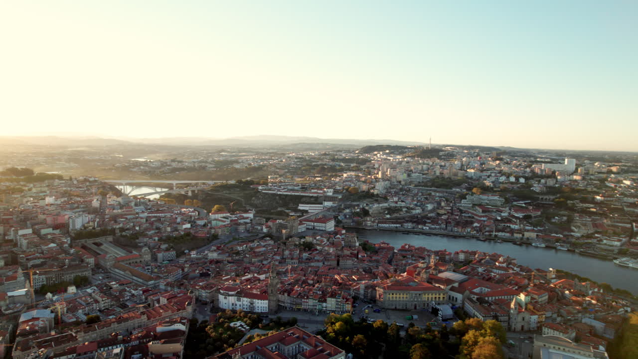 High aerial orbiting establishing shot of Porto, Portugal. Amazing city with houses and landmarks.