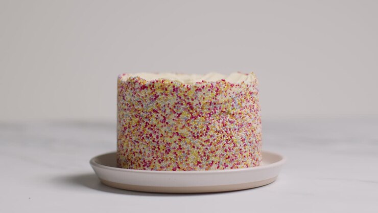 Studio Shot Of Birthday Cake Covered With Hundreds And Thousands Decorations 4