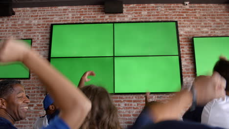 friends watching game in sports bar shot in slow motion