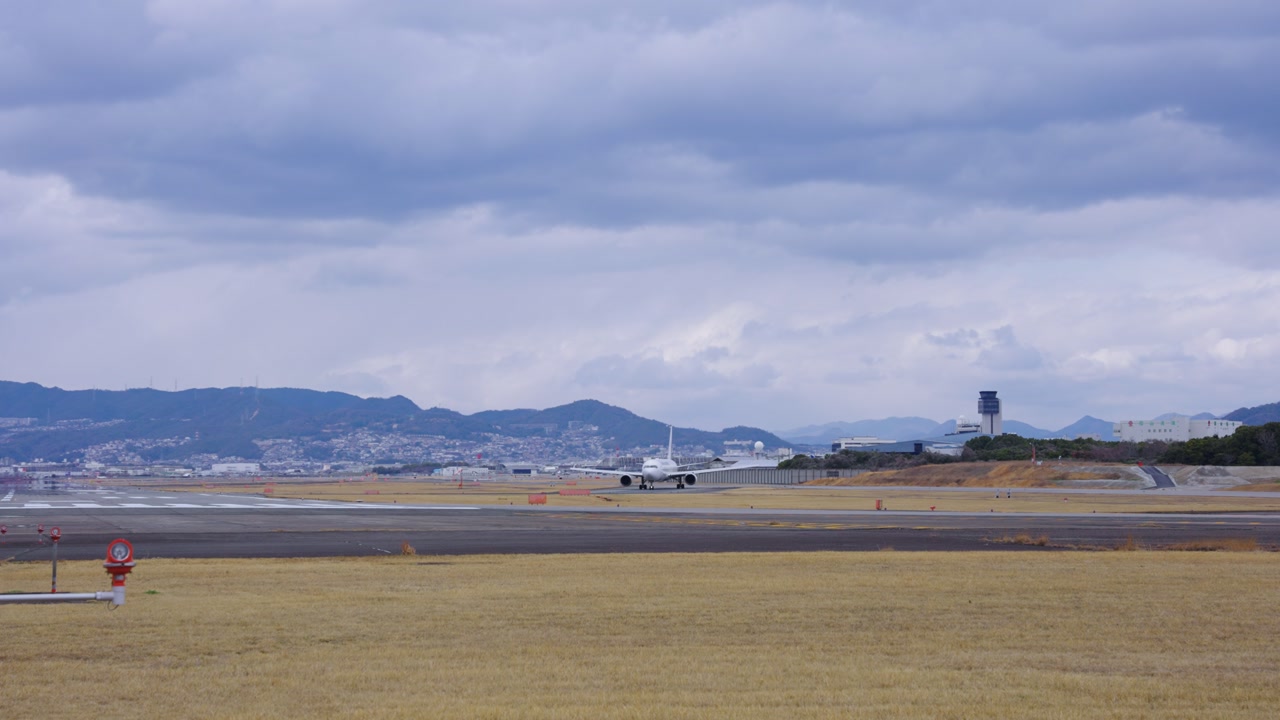 Japanese Domestic Flight Approaches Runway to Take Off, Atami Airport Osaka
