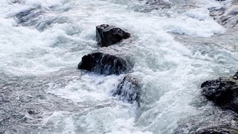 close up of fast flowing white water river over rocks on the ohinemuri river in north island of new zealand aotearoa