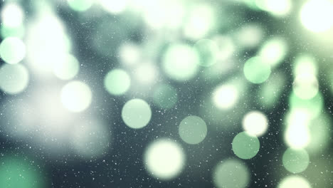 nieve cayendo con círculos de navidad de luz bokeh