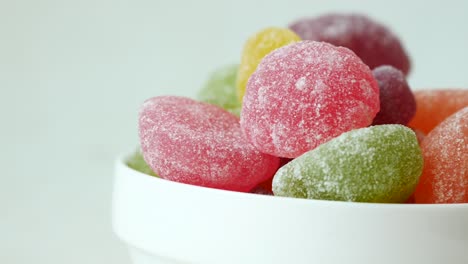 colorful gummy candies in a white bowl