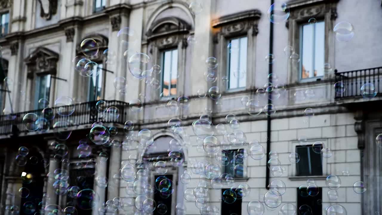 a clip aout bubbles beimg created in &acute;front of a historical building