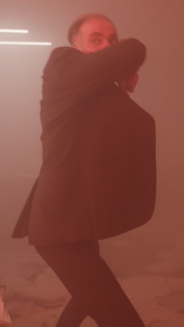 man in a suit in a smoky room