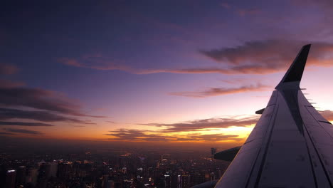 stunning aerial view of a city at sunset from an airplane