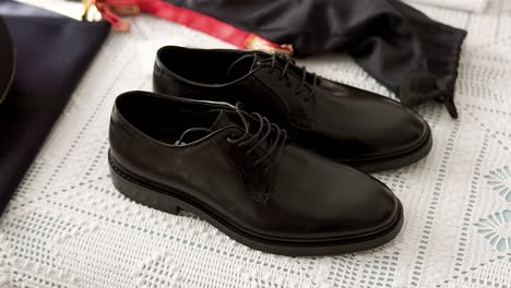 Close-Shot-Of-Groom-Black-Formal-Shiny-Shoes-Set-For-Wedding-Ceremony