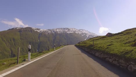 driving on panoramic road through swiss alps