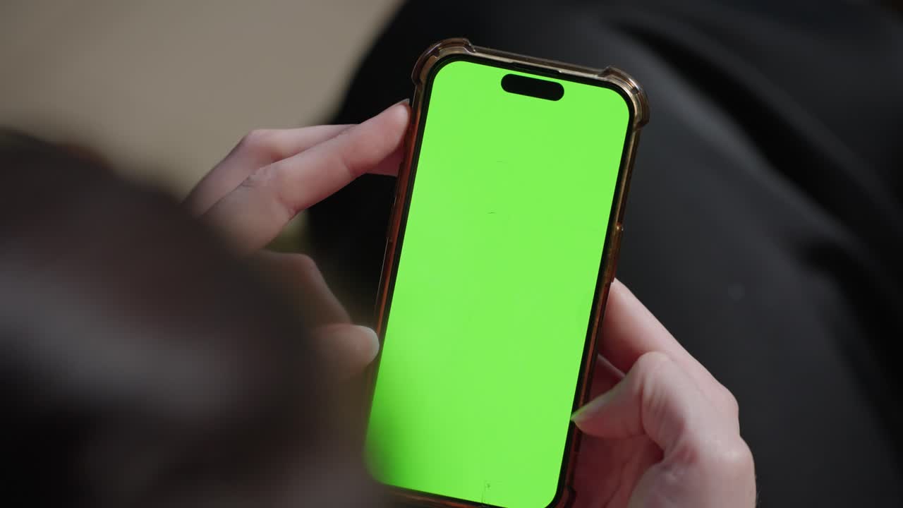 4K green screen footage of an iPhone 15 shot with a Sony FX6 camera, ideal for compositing in visual effects or commercial projects.