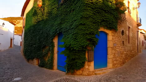 ivy-covered building with vibrant blue doors on a cobblestone street