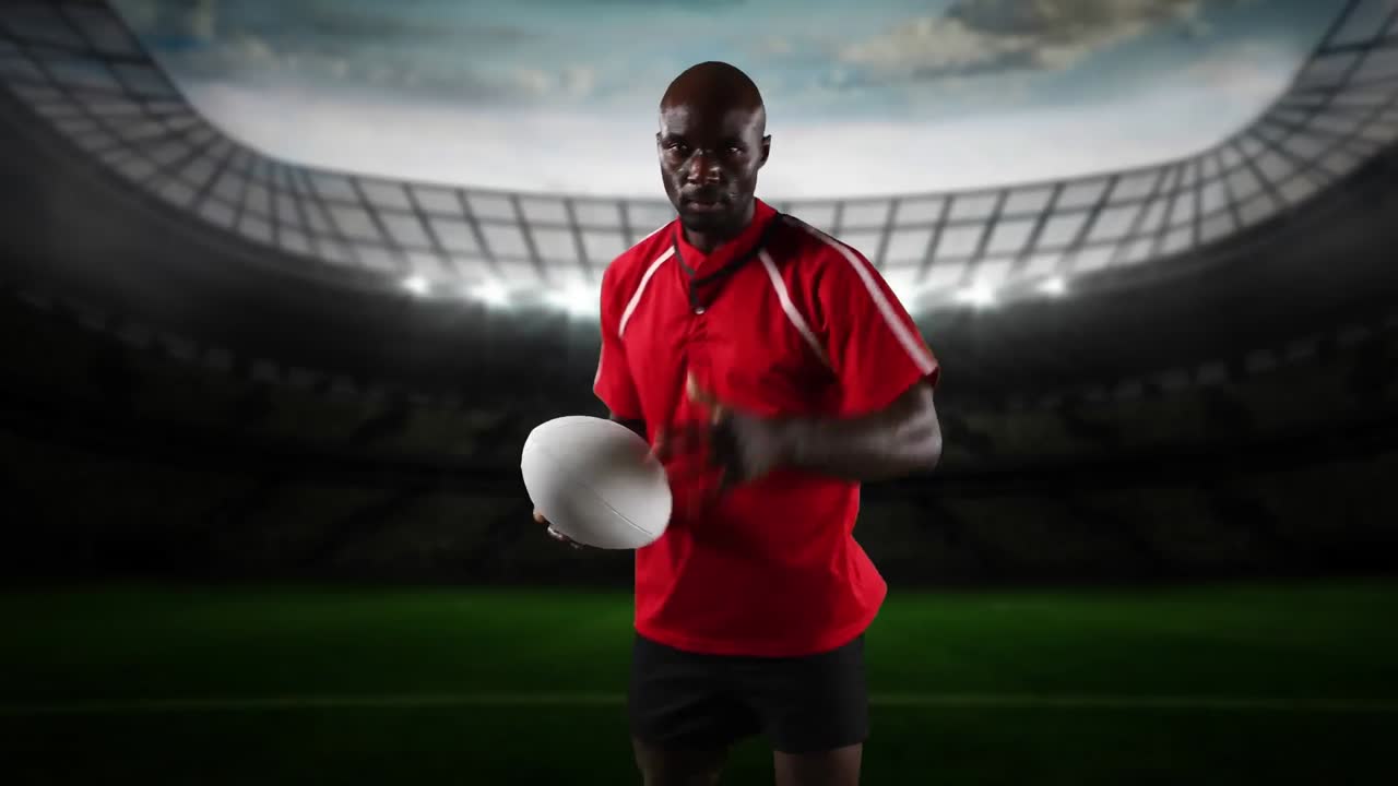 Professional rugby player standing in front of a stadium