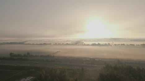 misty sunrise over countryside highway