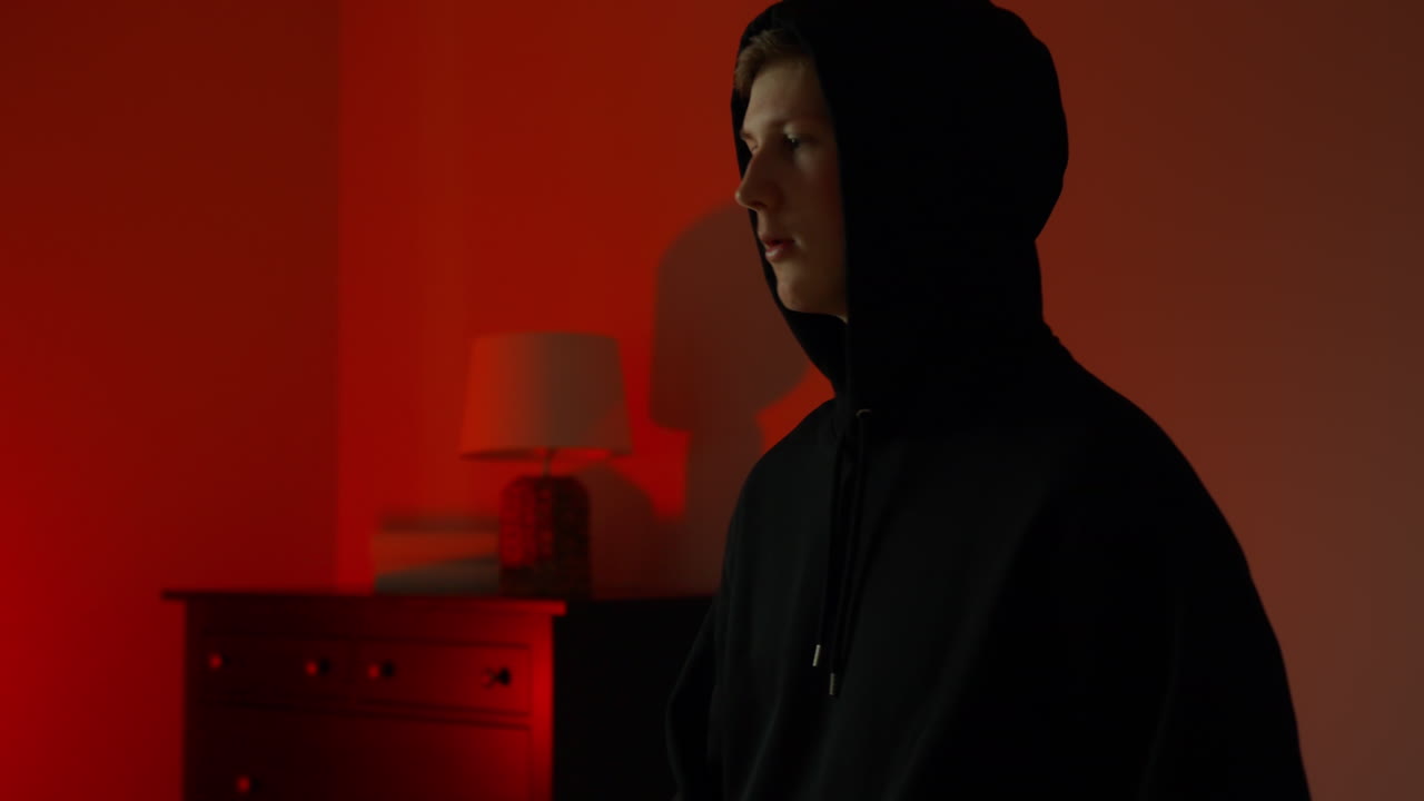 Cinematic Side Profile of Young Male Vocalist in Low Light Atmosphere