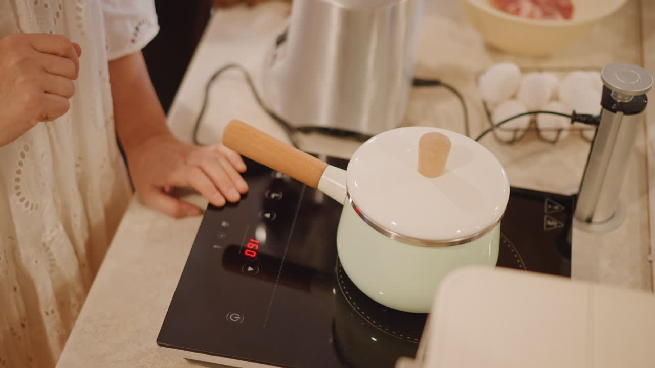 Cooking warm pumpkin dish during autumn days. Homestyle pumpkin recipe being made in cozy autumn kitchen. Home cook prepares hearty pumpkin dish filled with spices this autumn season