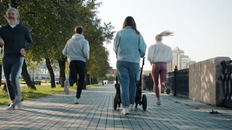 people walking and running in a park