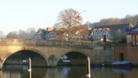 traffic crossing bridge over river thames