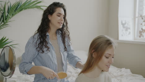 two women having fun styling each other's hair