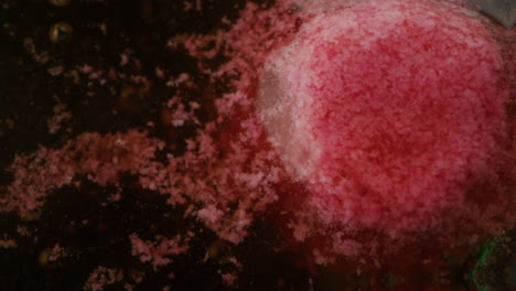 pink spheres in liquid