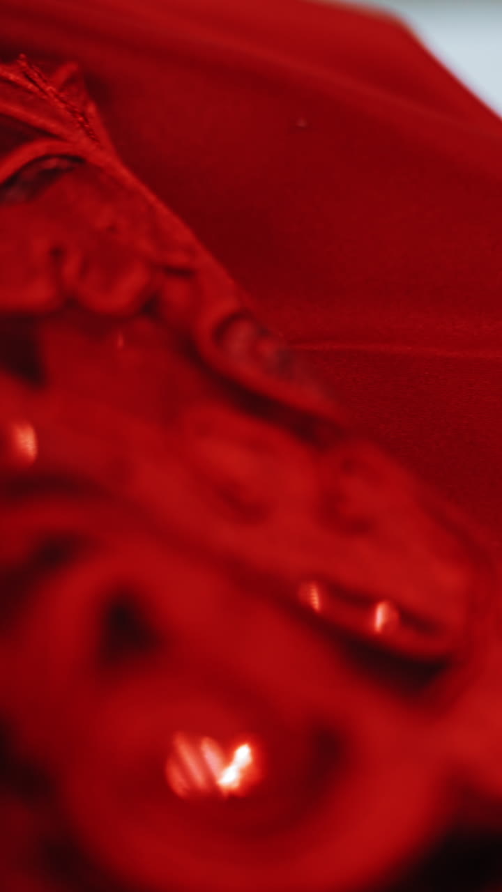 White sheets of papers with stylish sketches painted on the table. A lot of creative works of a fashionable designer and red material for seamstress in atelier. Vertical video