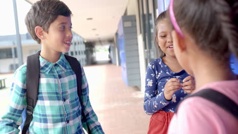 in school, diverse group of young friends are chatting