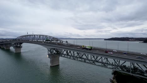 Aerial-view-of-the-Auckland-Harbour-Bridge-in-Auckland,-New-Zealand-with-car-traffic-4k